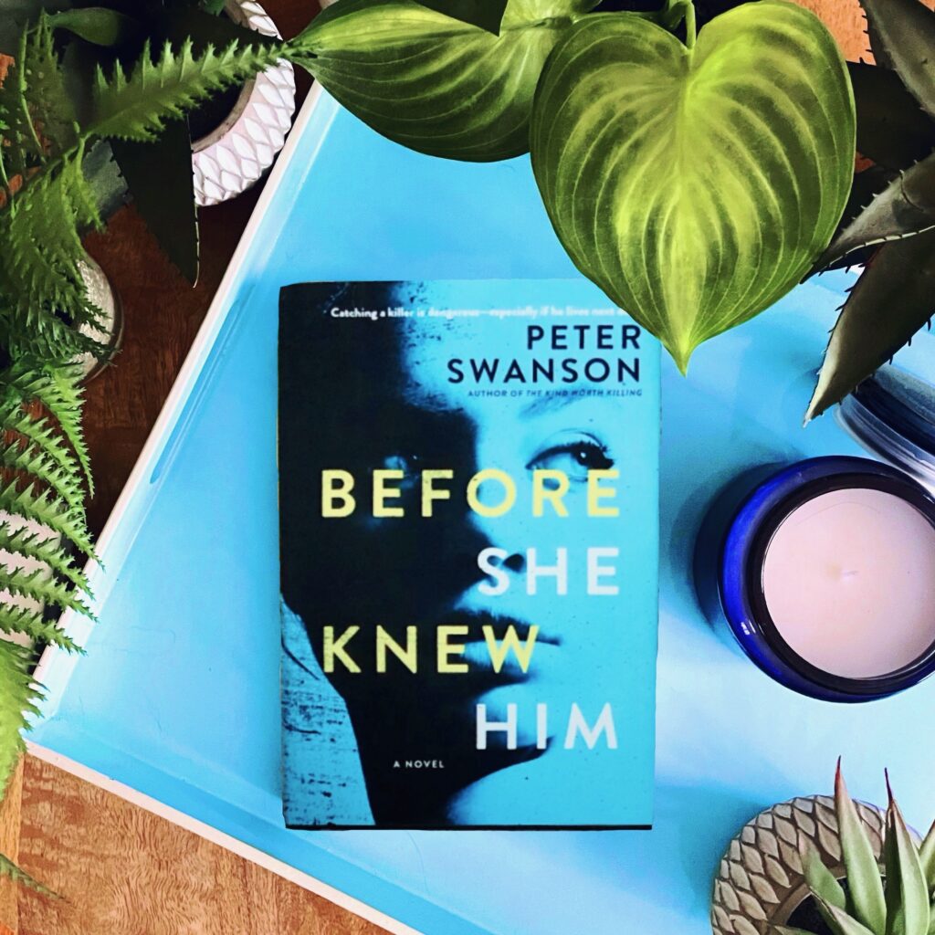 Before She Knew Him is a psychological thriller by Peter Swanson with a light blue cover and a woman's face in partial shadow