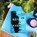 Before She Knew Him is a psychological thriller by Peter Swanson with a light blue cover and a woman's face in partial shadow