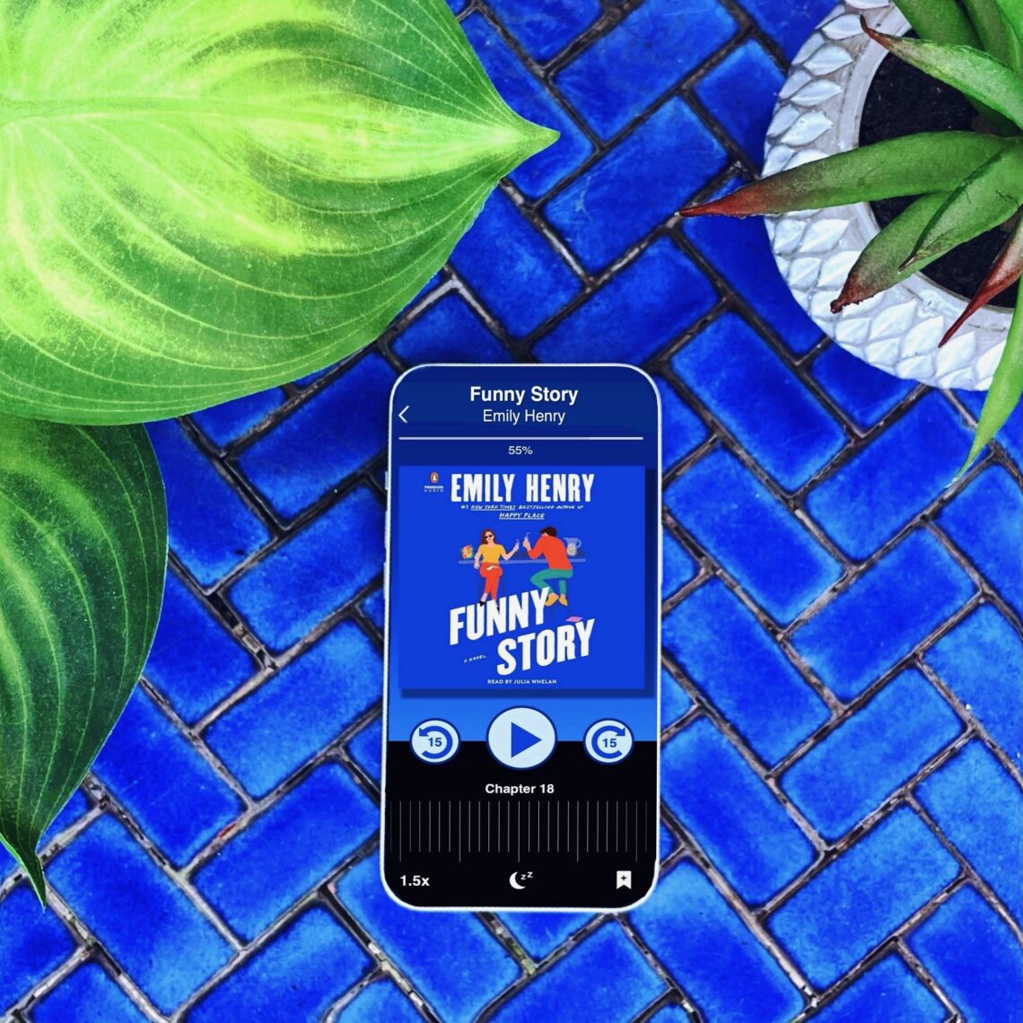 Funny Story is a book by Emily Henry; the audiobook is narrated by Julia Whelan. The cover is bold blue with two figures on it.