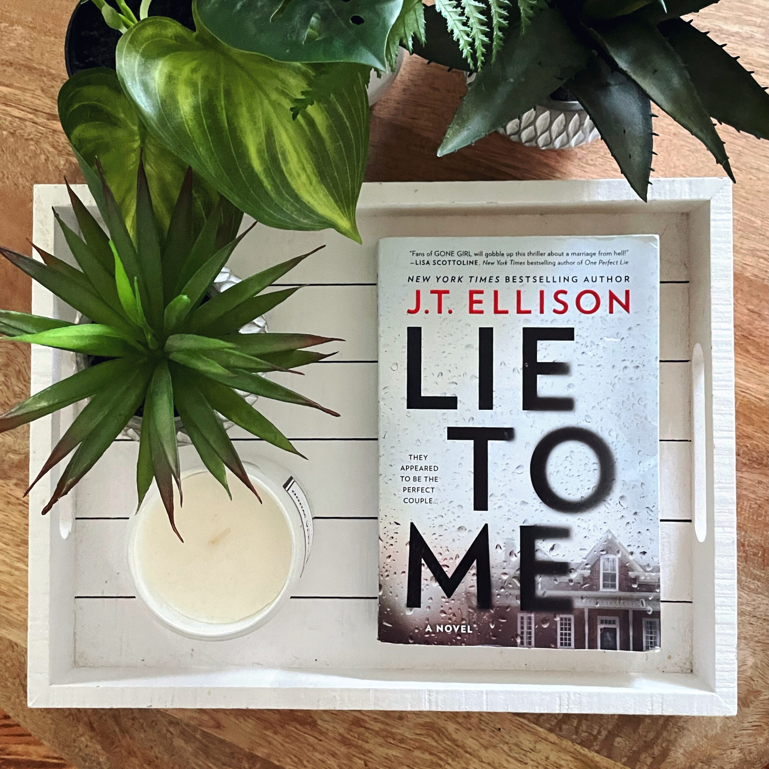 Lie to Me is a jaw-dropping psychological thriller by J. T. Ellison with a white cover and rainy window in front